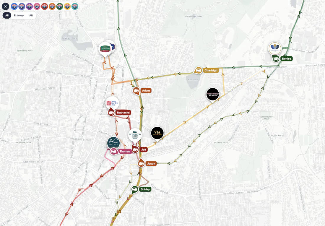 The dispatch map during service: nine colour-coded shuttle routes across Worcester and Auburn, with hotel and restaurant stops marked by their own logos and live buses labelled with their drivers’ names.